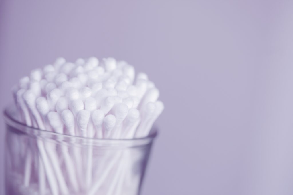 Plastic cup of Q-tips