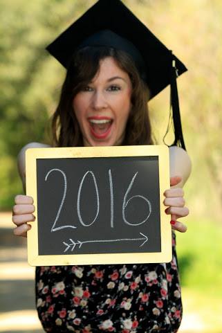 Jenna wearing college graduation cap with tassel and holding chalkboard sign that says "2016"
