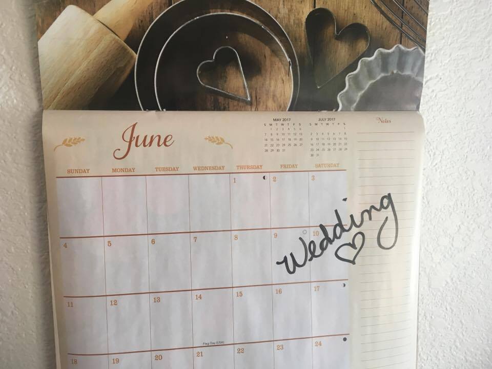 June wall calendar with the word "Wedding" and a heart drawn in Sharpie on June 10th