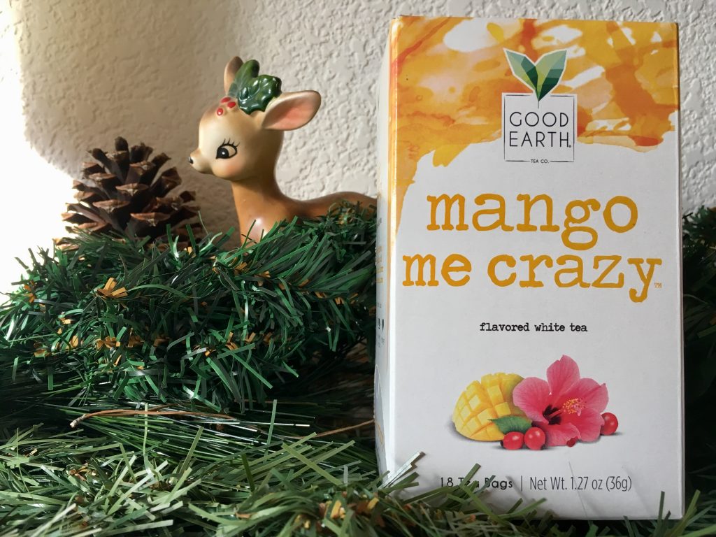 Mango Me Crazy tea box on mantle next to Christmas decorations