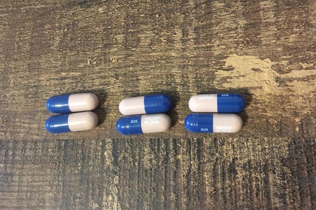 Six ANI Pharmaceuticals vancomycin pills laying on the kitchen table